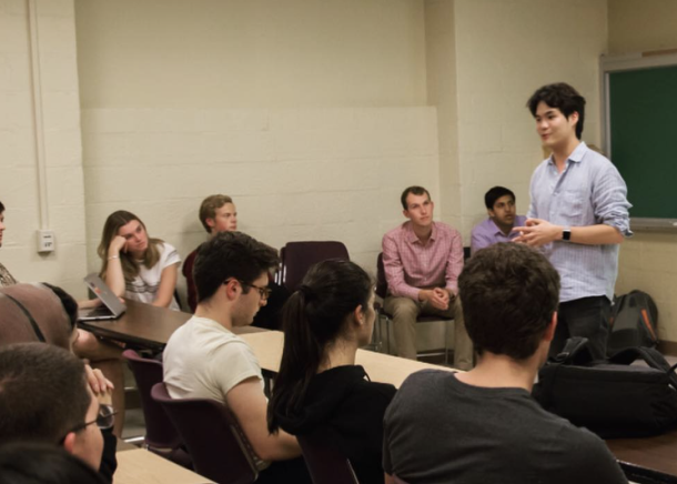 Vital members at a meeting with a presenter