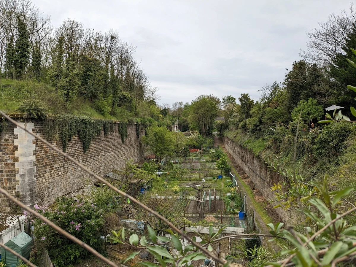 The dry moat of Fort d’Ivry in Paris, now planted as allotments