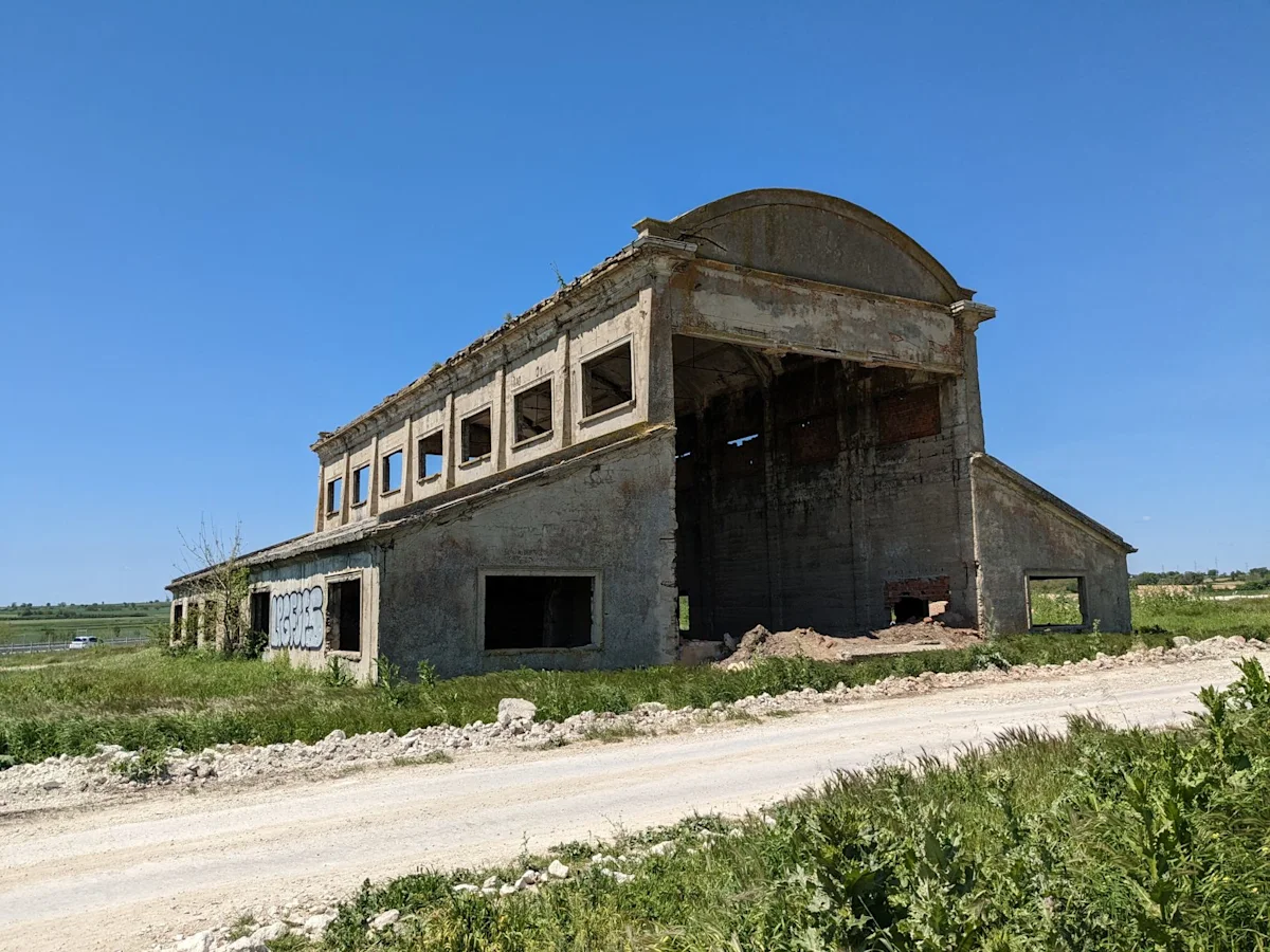 The 1912 Ottoman balloon hangar at Edirne, a ruined concrete building in a field