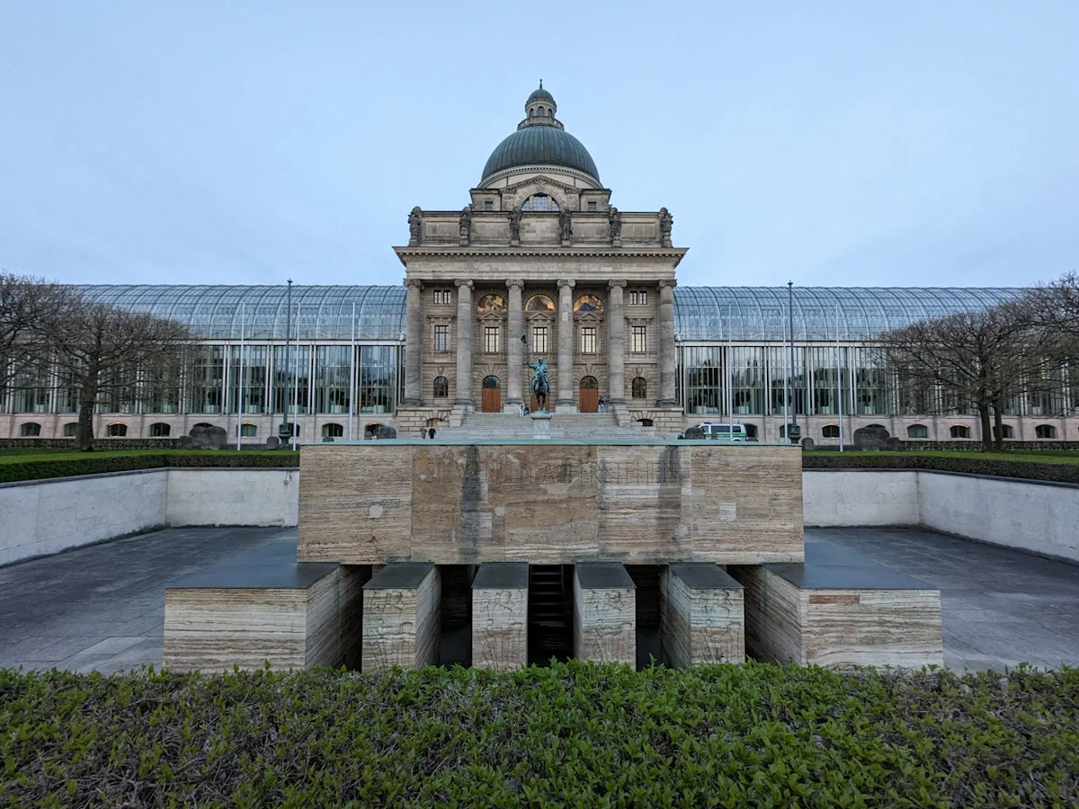 The Hofgarten war memorial with the domed Staatskanzlei behind