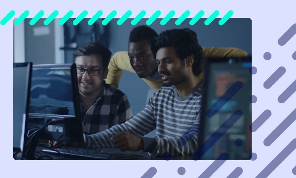 Software developers collaborating on a custom software project, emphasizing teamwork and communication to avoid common mistakes.