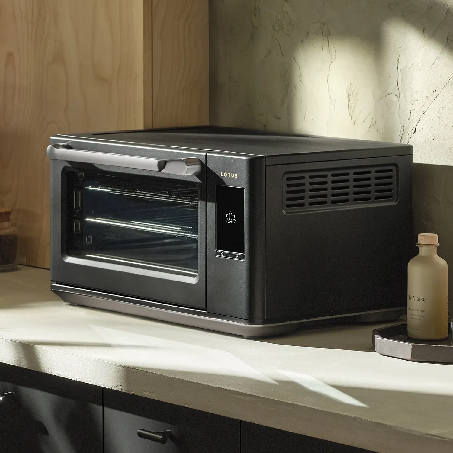The Luminary oven in Obsidian on a styled kitchen counter