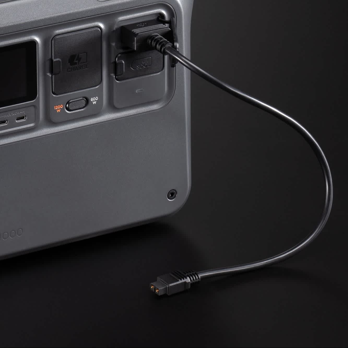 DJI SDC to XT60 Power Cable (12V) connected to DJI Power 500 in front of a black background.