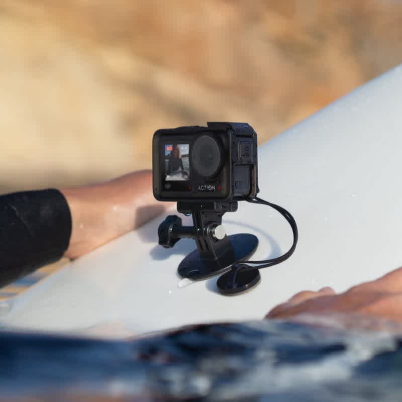 DJI Osmo Action Surfing Tether attached to user surfing.