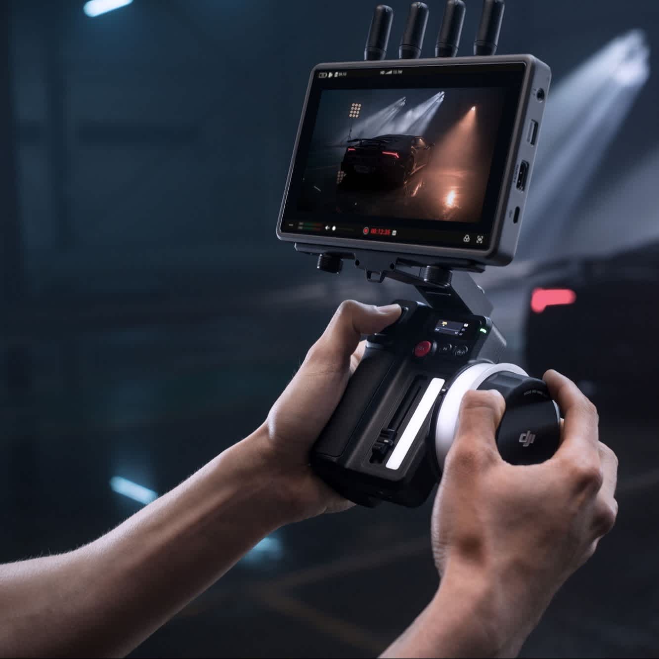 DJI Focus Pro Hand Unit in use with images on screen.