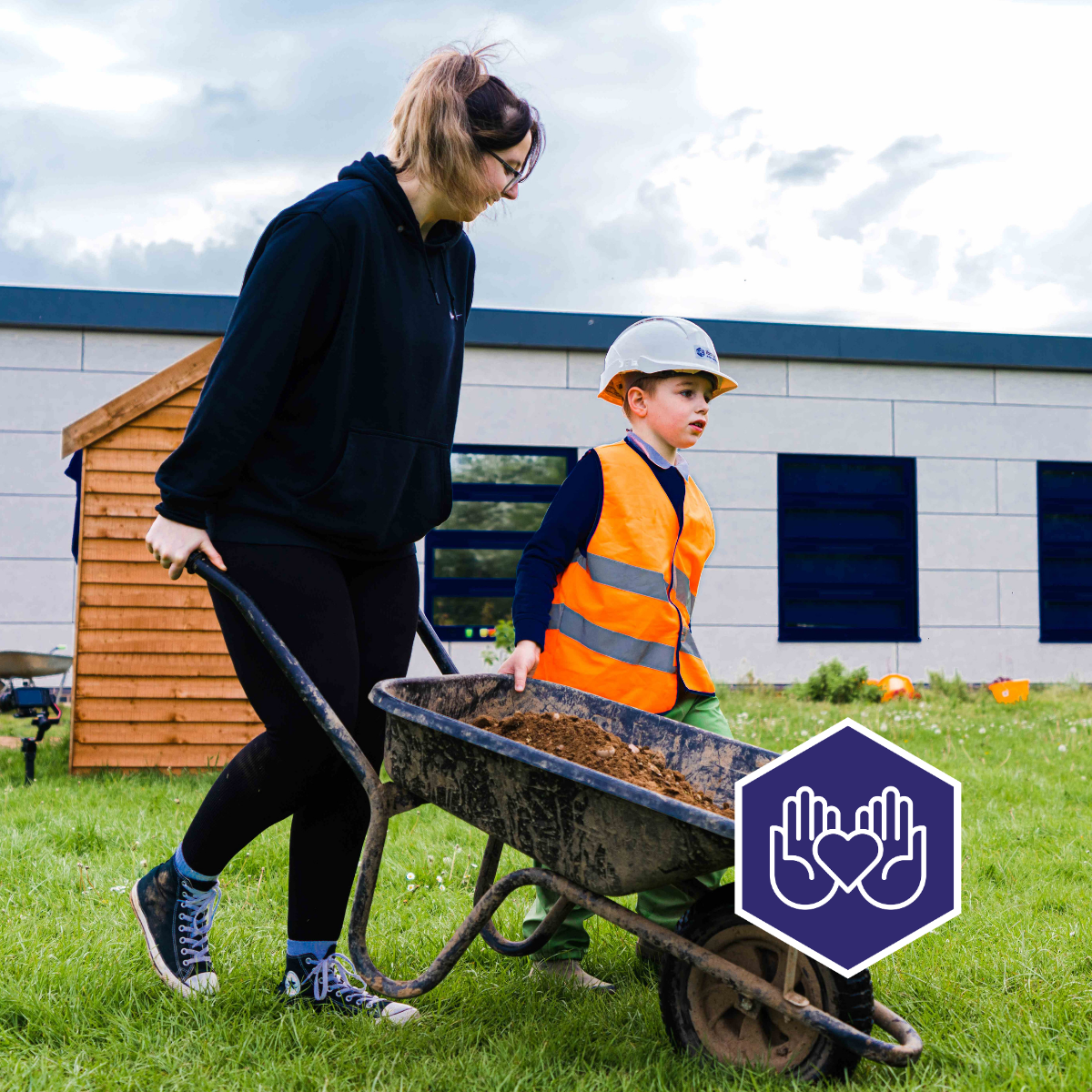 2.204 Employees volunteering at a local school to create a garden area for students - sustainability