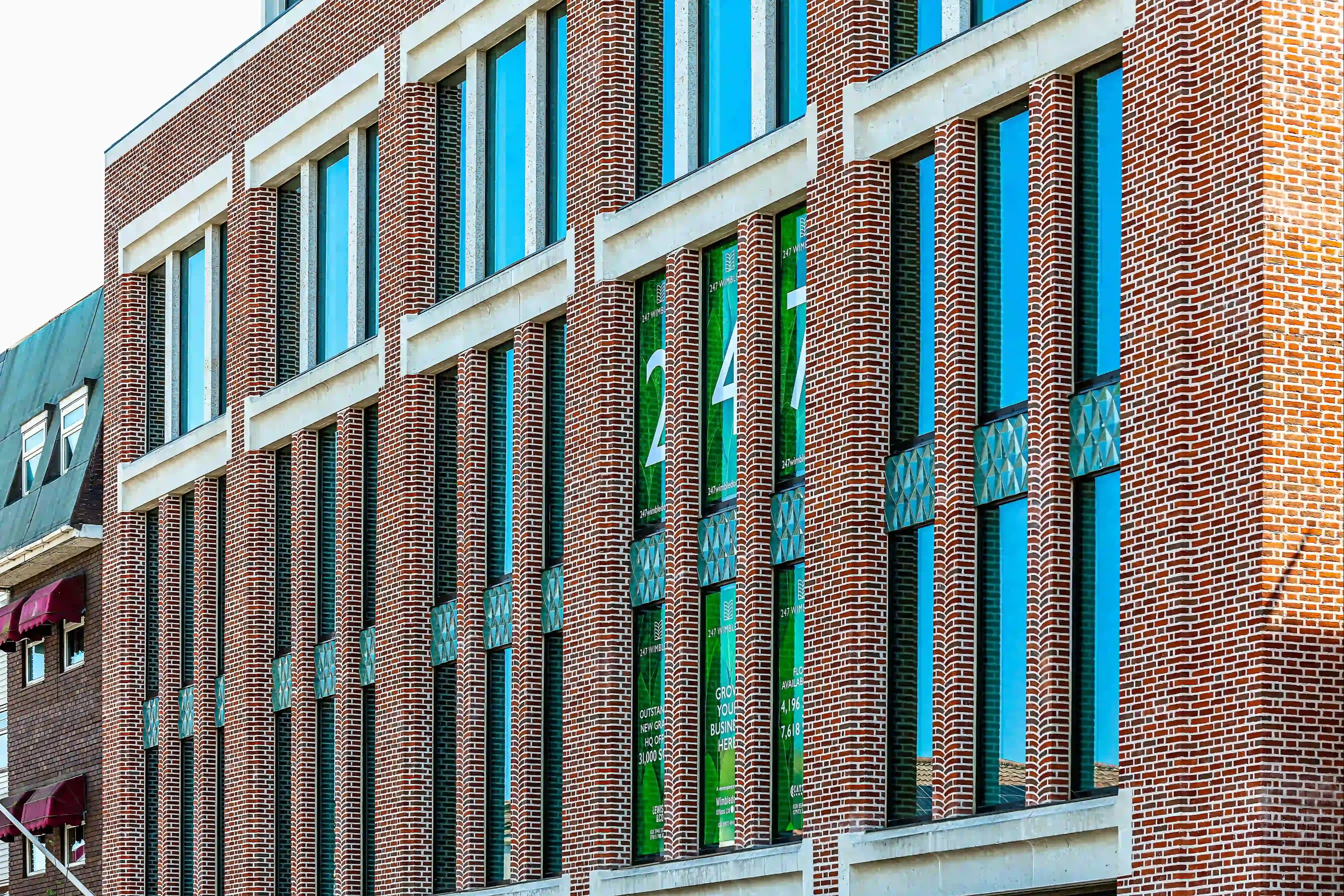 247 Wimbledon multi-use building uses Swanage Handmade Light Red Multi 50mm bricks
