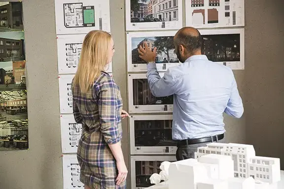 Architects discussing project designs (stock image)