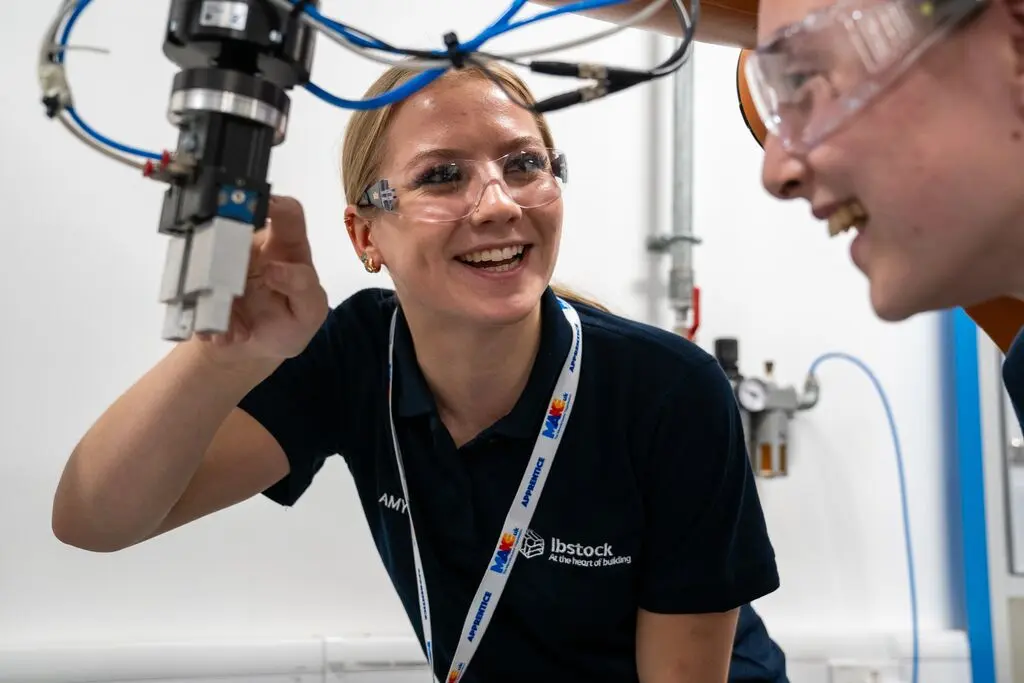 Engineering Apprentice, Amy on robot at MAKE UK