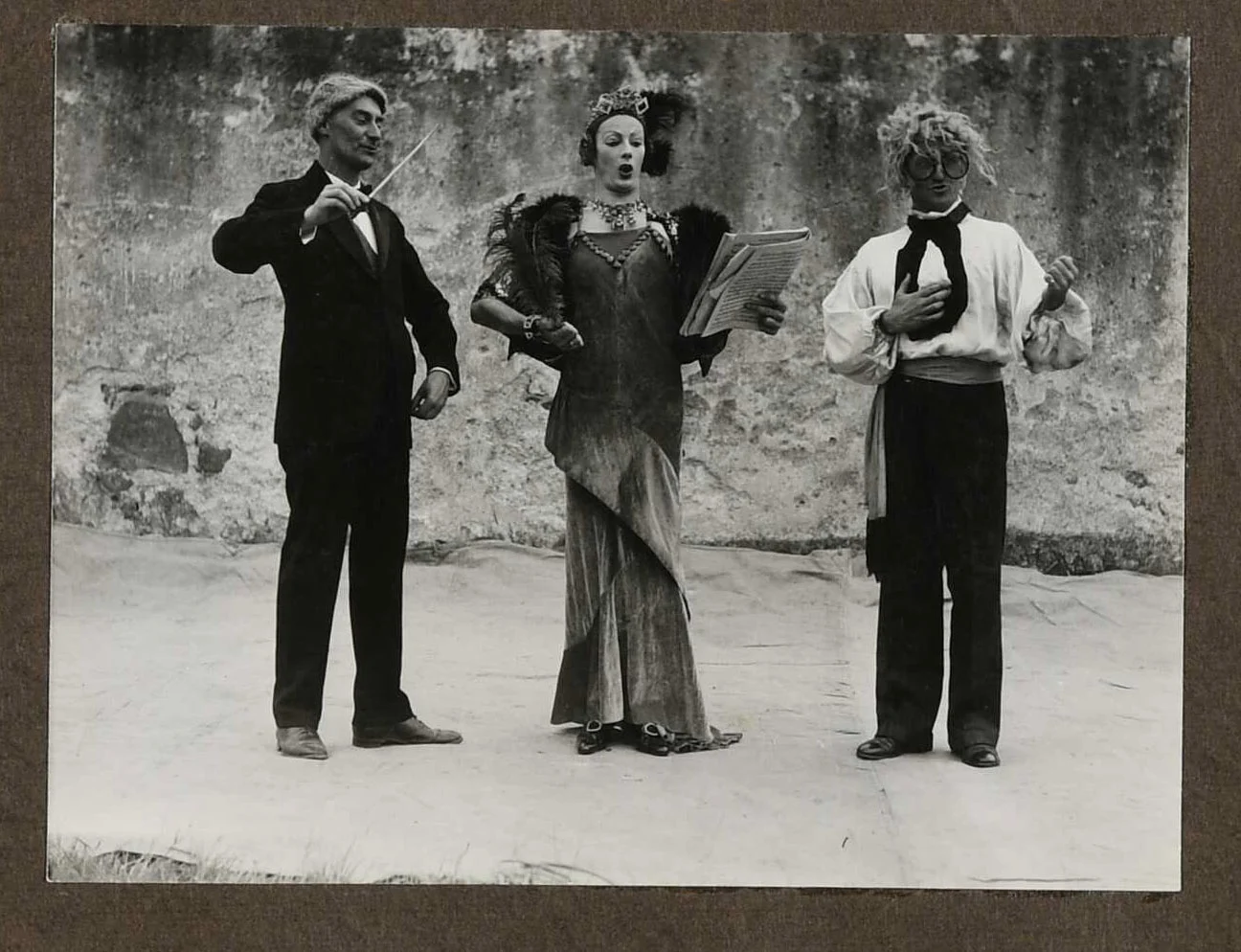 3 people in costume in the middle of a performance.