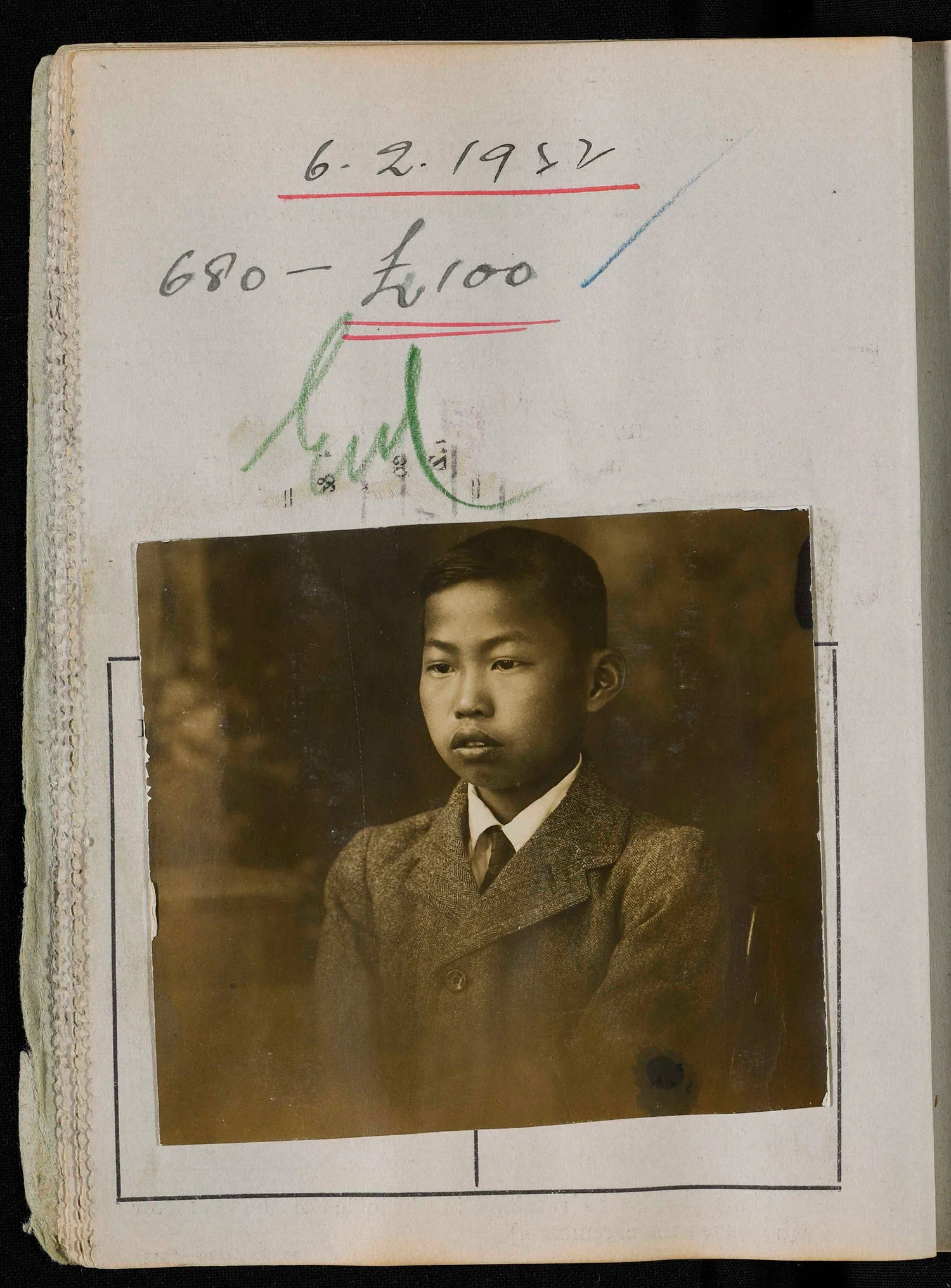 Black and white photo of a young man pasted on an old paper with some text written on the top