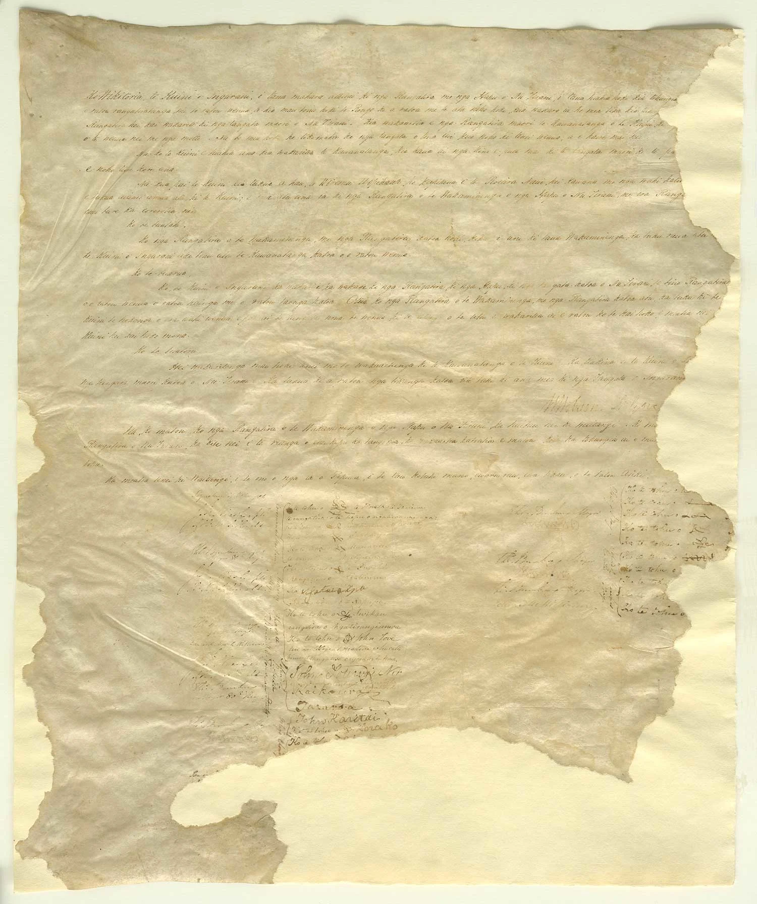 The damaged sheet of parchment filled with handwritten text, signatures and marks.