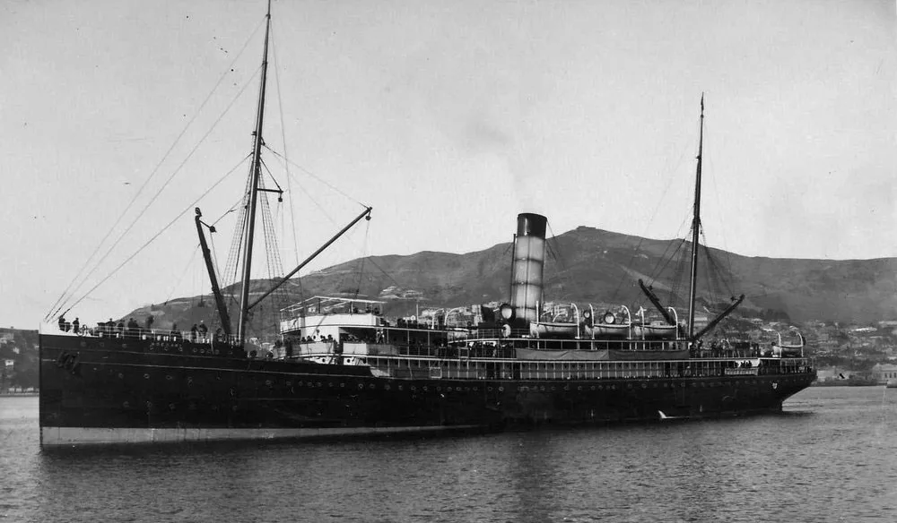 Black and white photo of a ship sailing in a sea