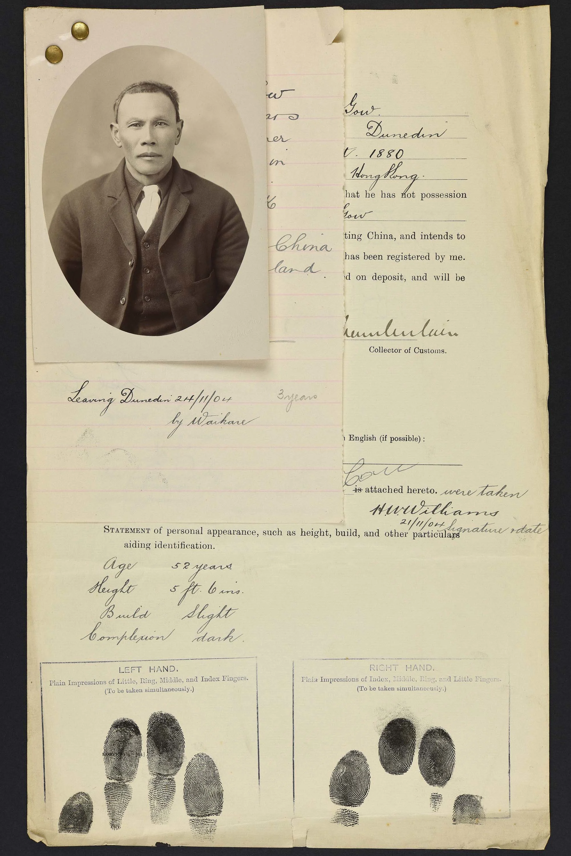 Sepia photo portrait of a Chinese man pinned to his immigration papers