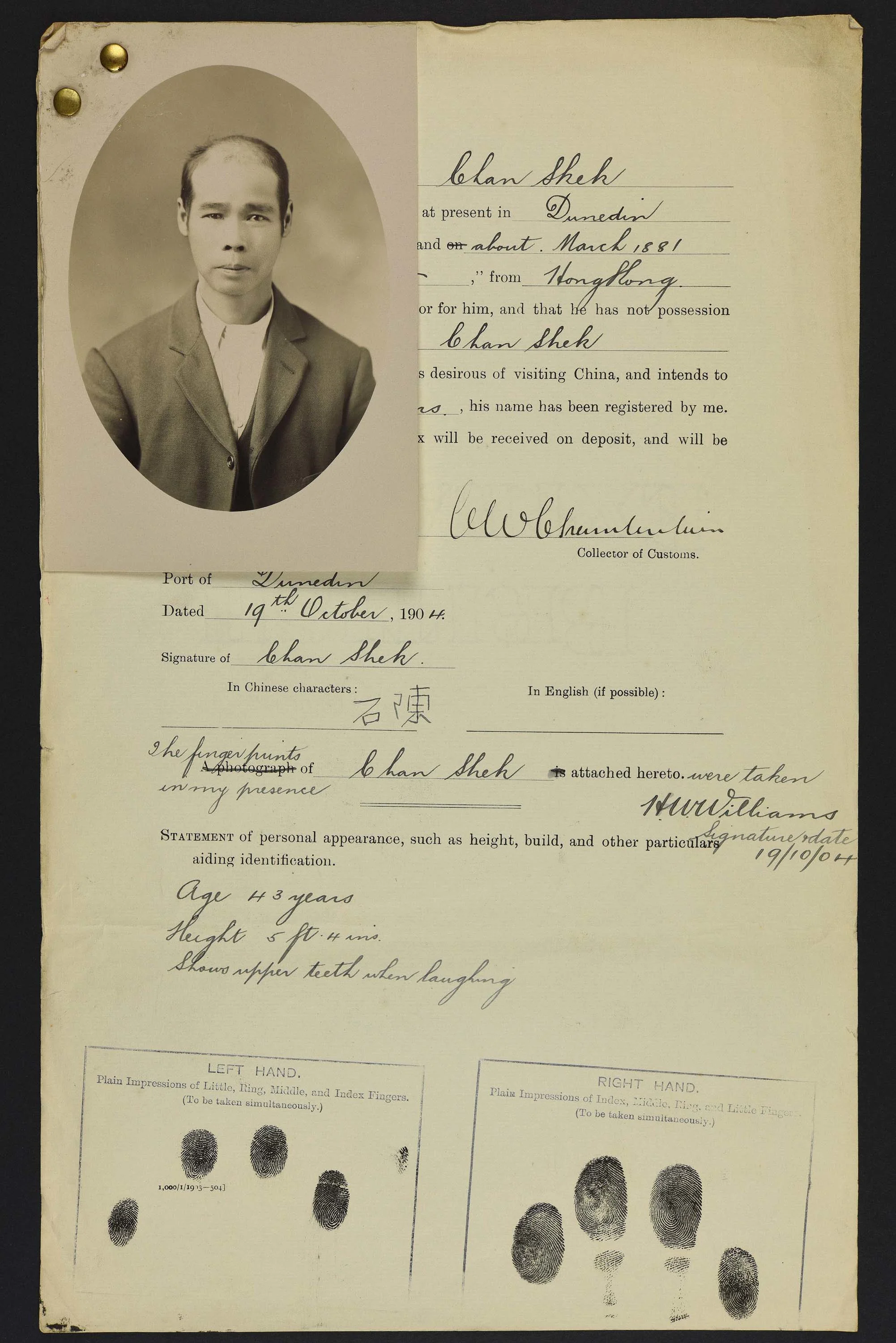 Sepia photo portrait of a Chinese man pinned to his immigration papers