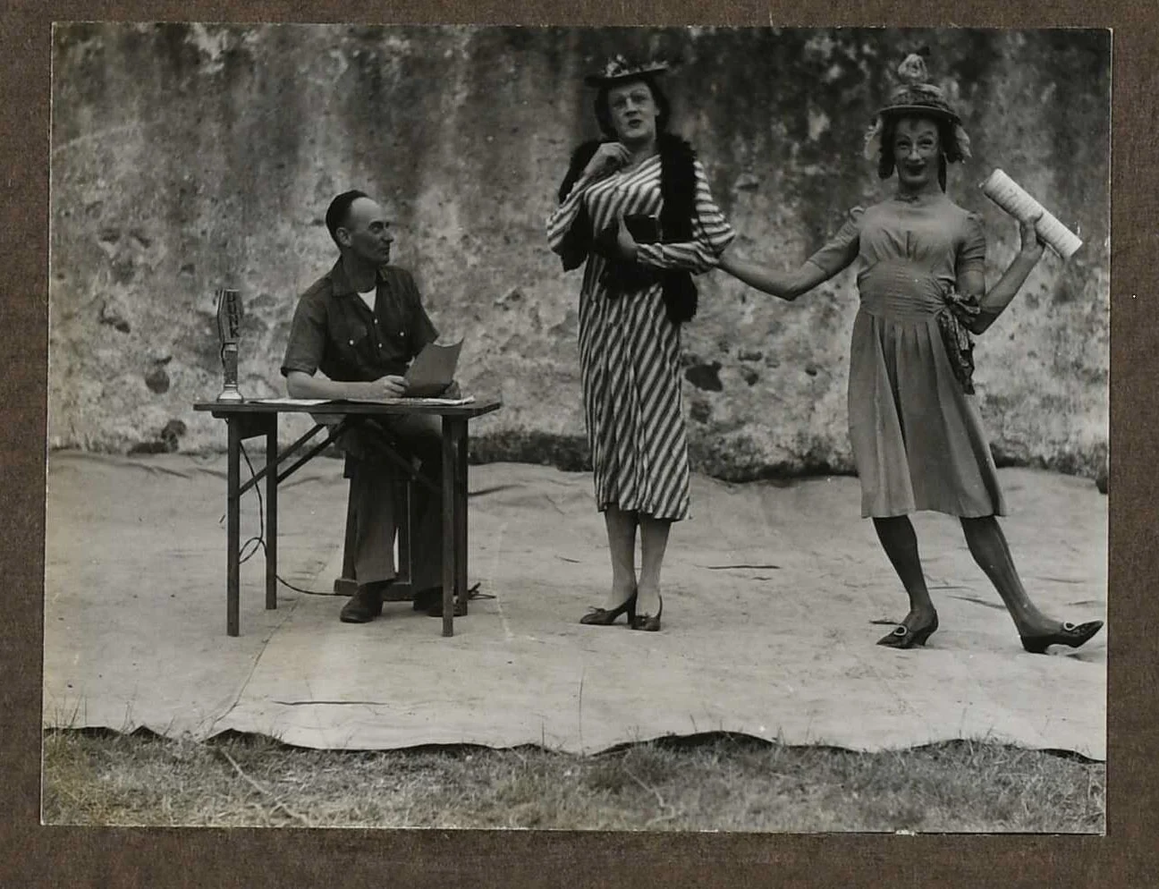3 people in costume mid performance.