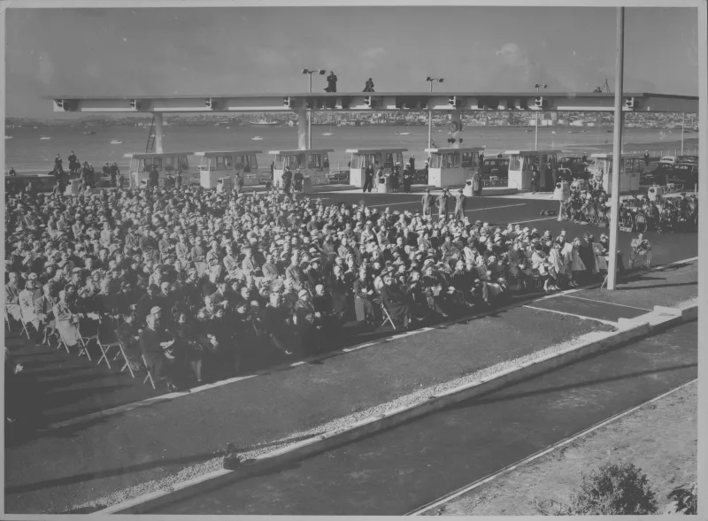 Showing the crowd who are seated at the official Bridge opening