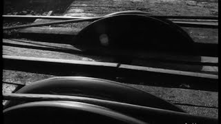 A still from 'Pictorial Parade No. 195'. A close up of the tracks on a rope-railway.