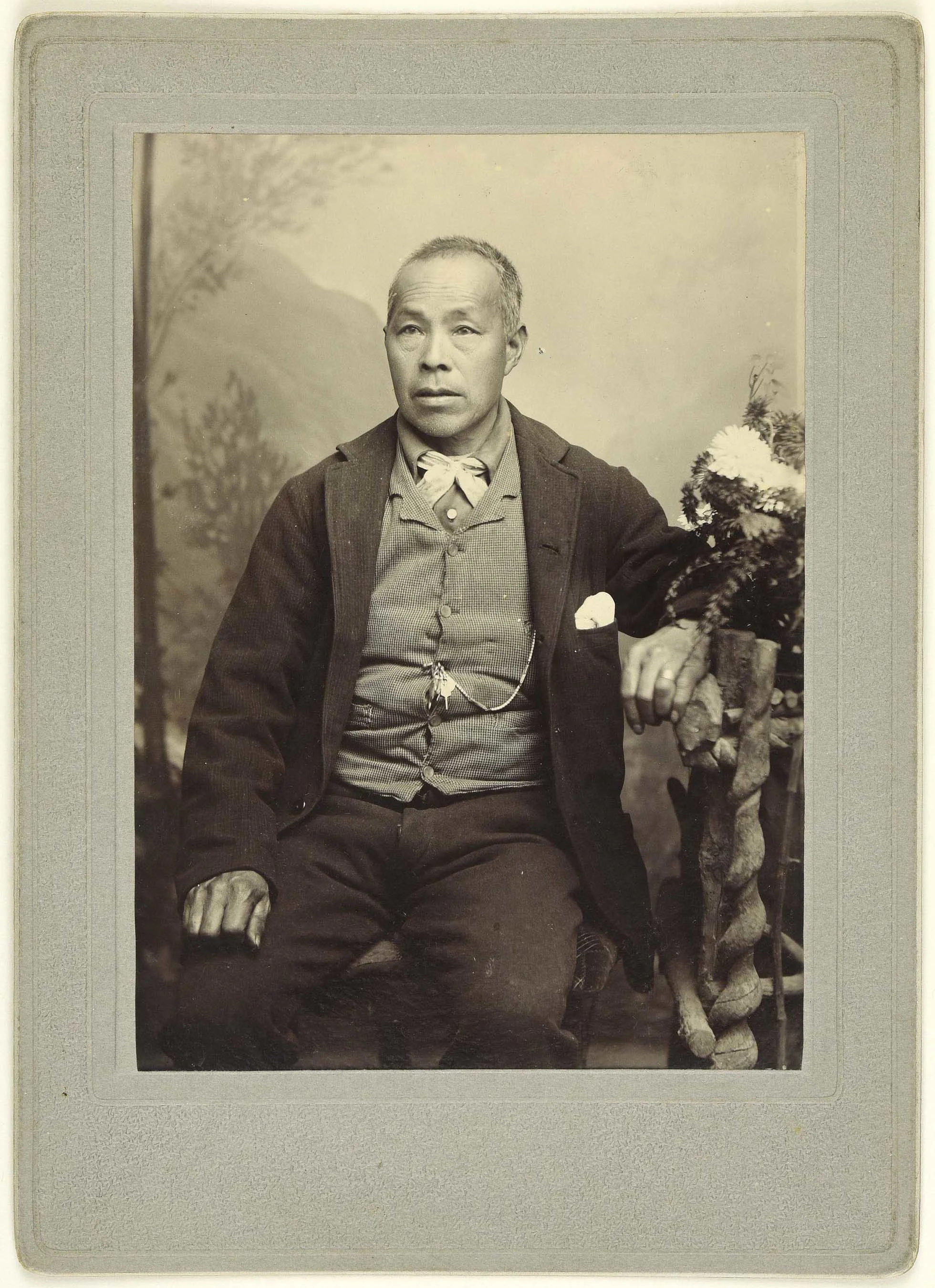 Sepia photo portrait of a Chinese man sitting