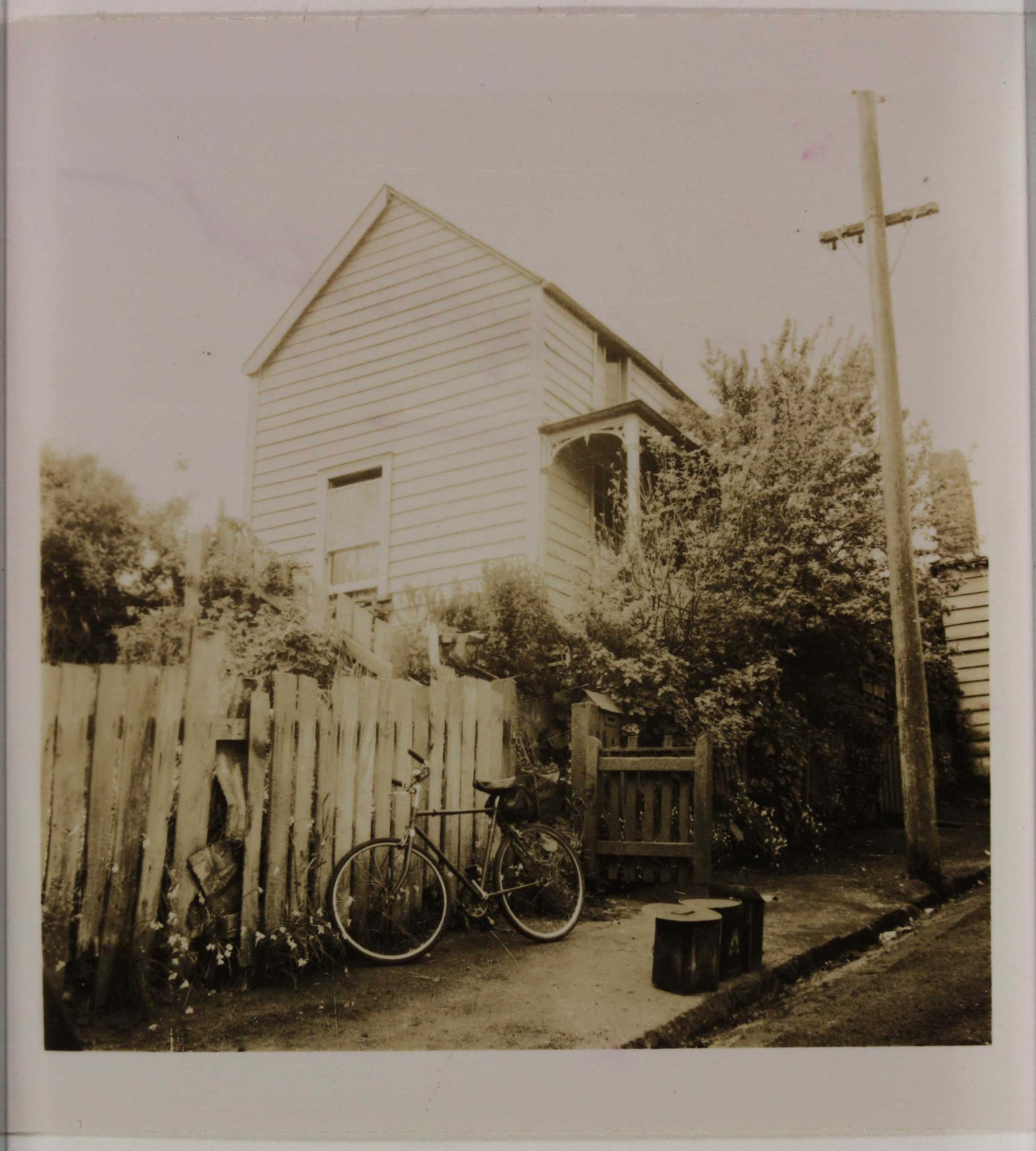Sepia photo of a house from the street