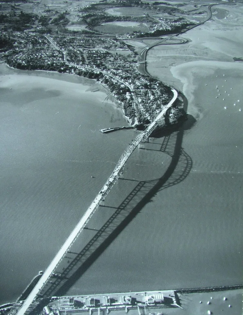 Aerial photo showing construction progress on Auckland Harbour Bridge on 13 April 1959