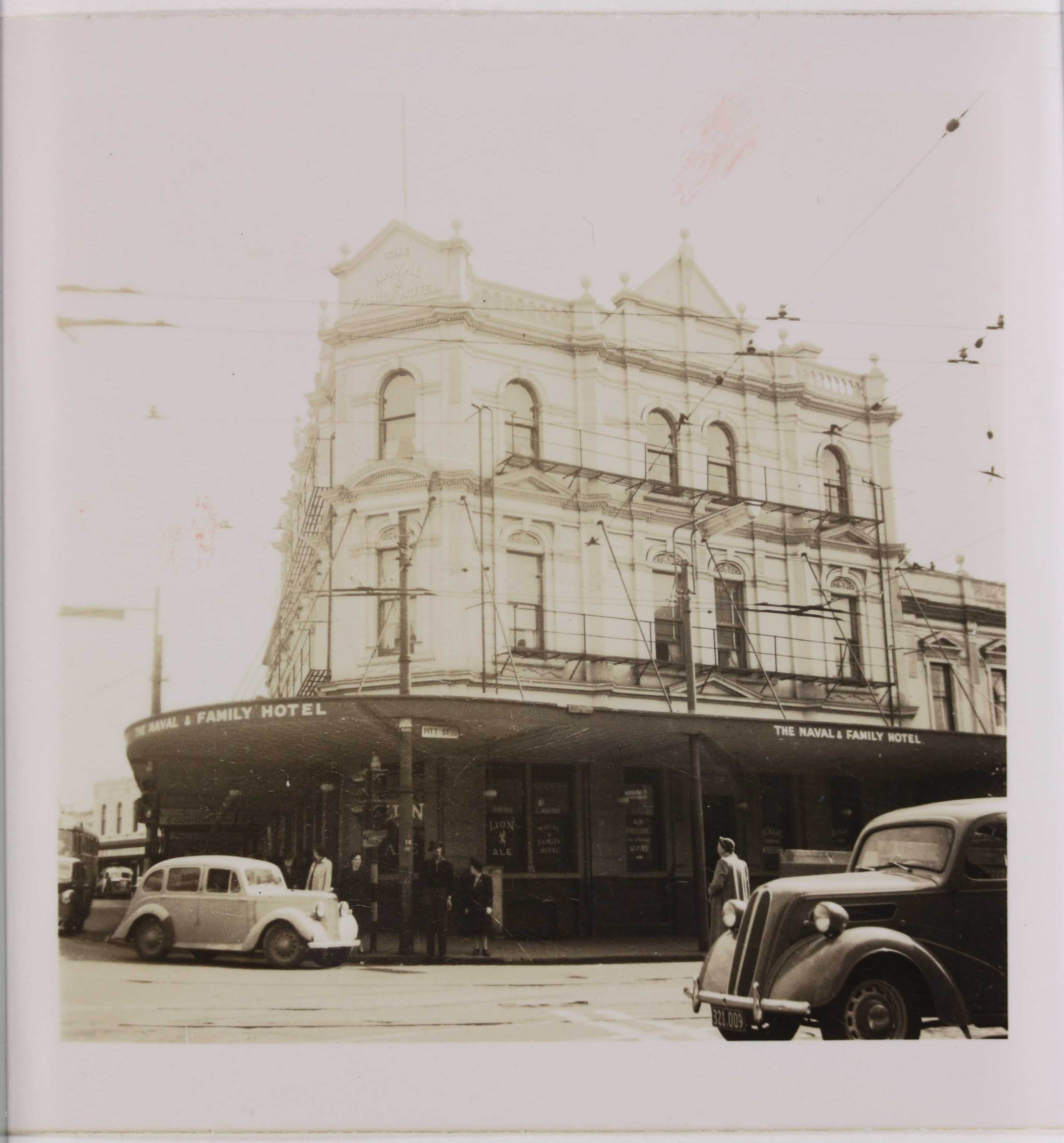 Sepia photo of a hotel from the street