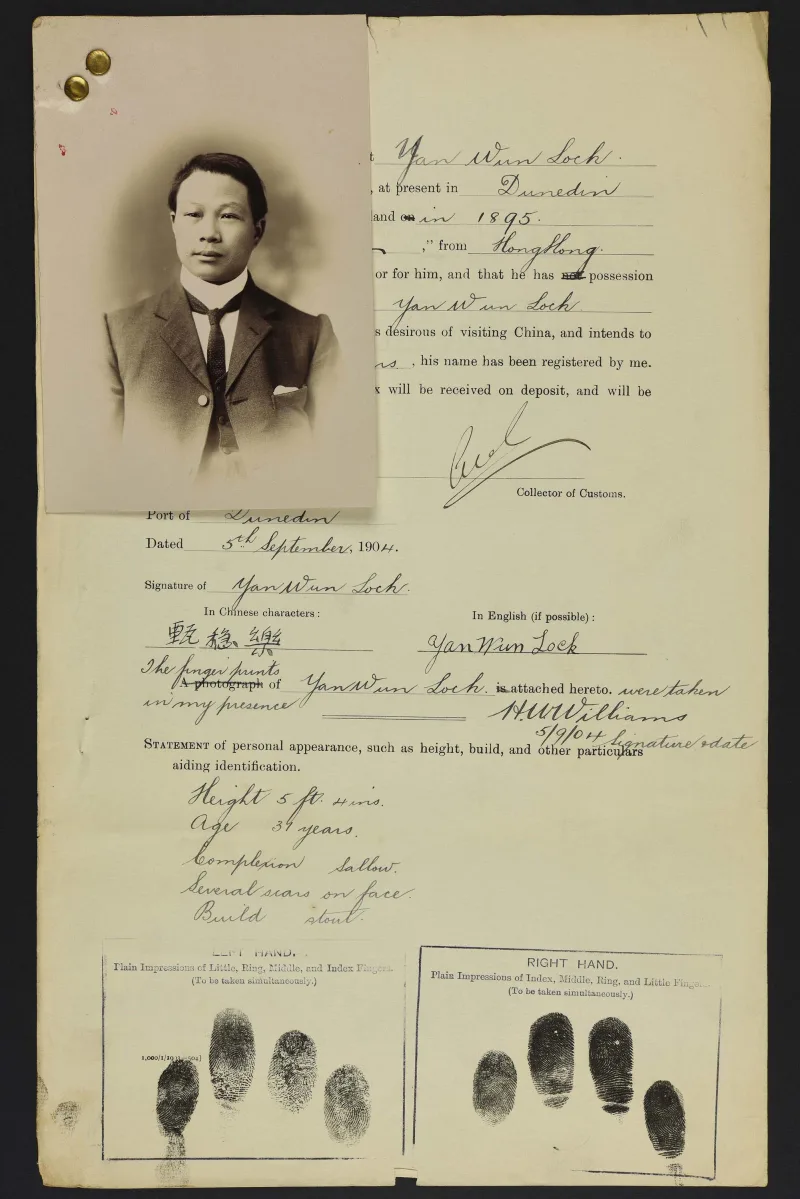 Sepia photo portrait of a Chinese man pinned to his immigration papers