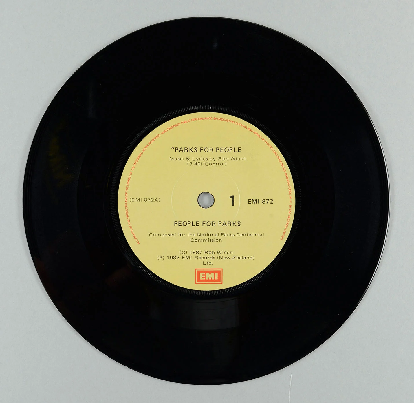 Black circular vinyl with yellow label in the center
