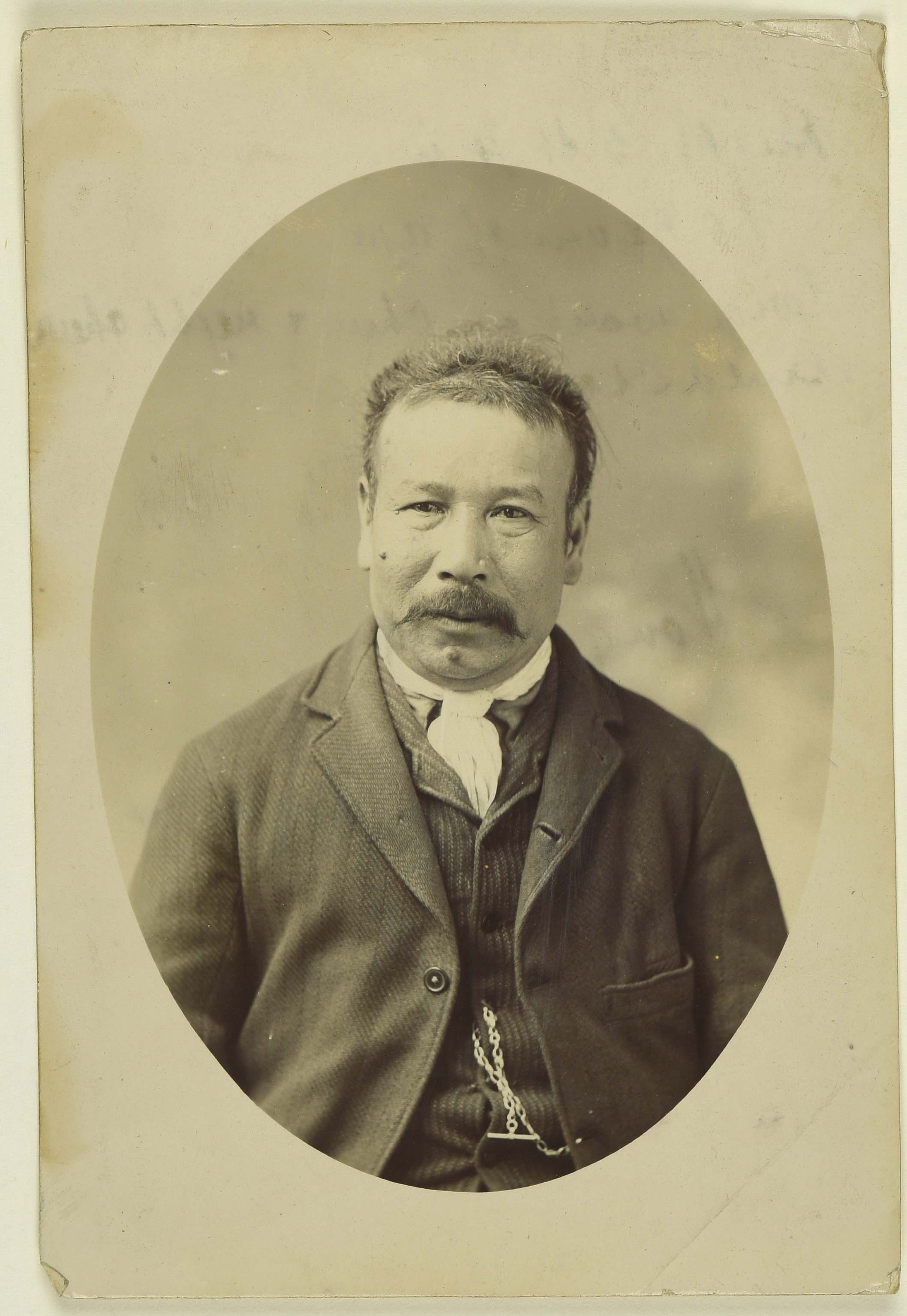Sepia photo portrait of a Chinese man with a moustache