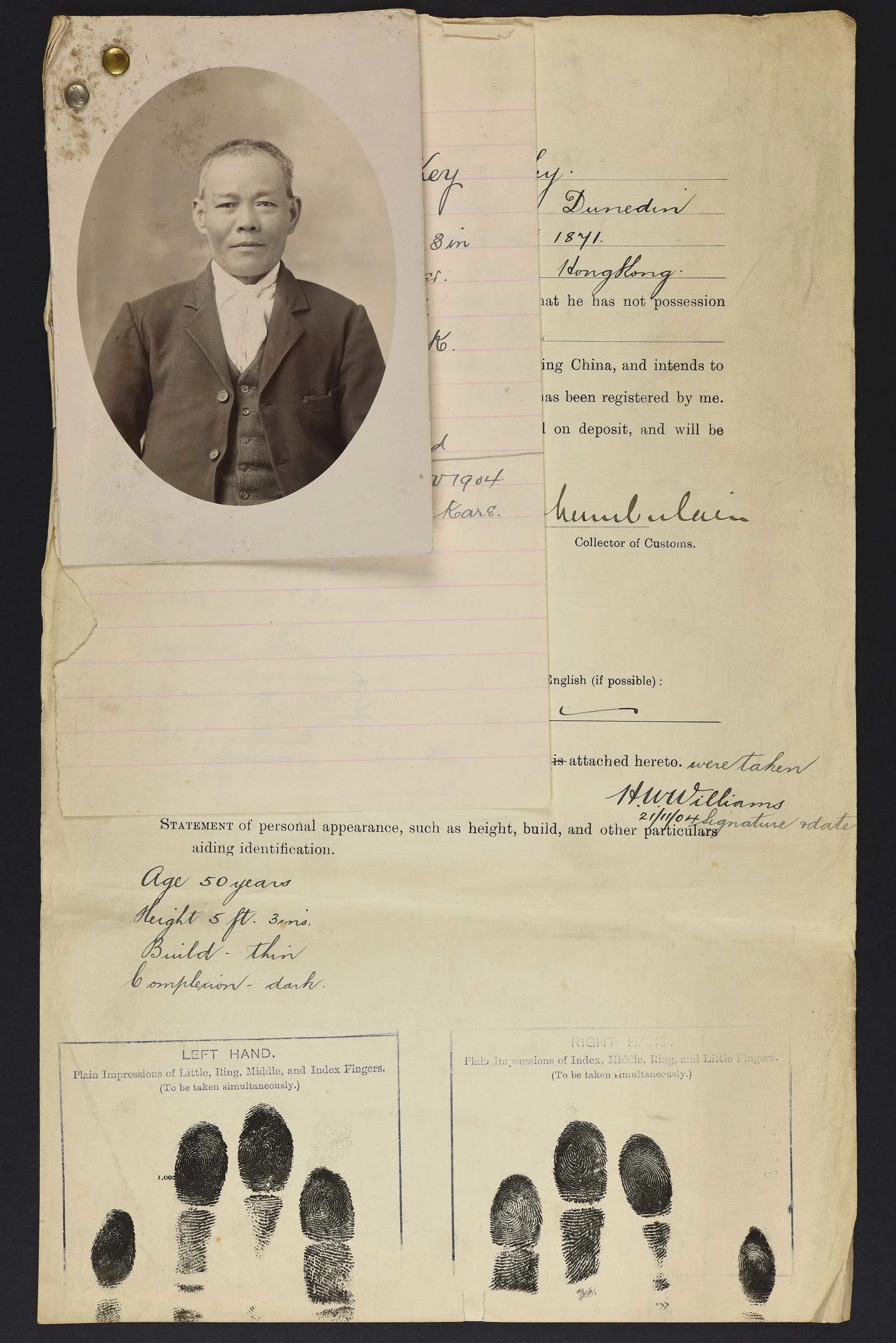 Sepia photo portrait of a Chinese man pinned to his immigration papers