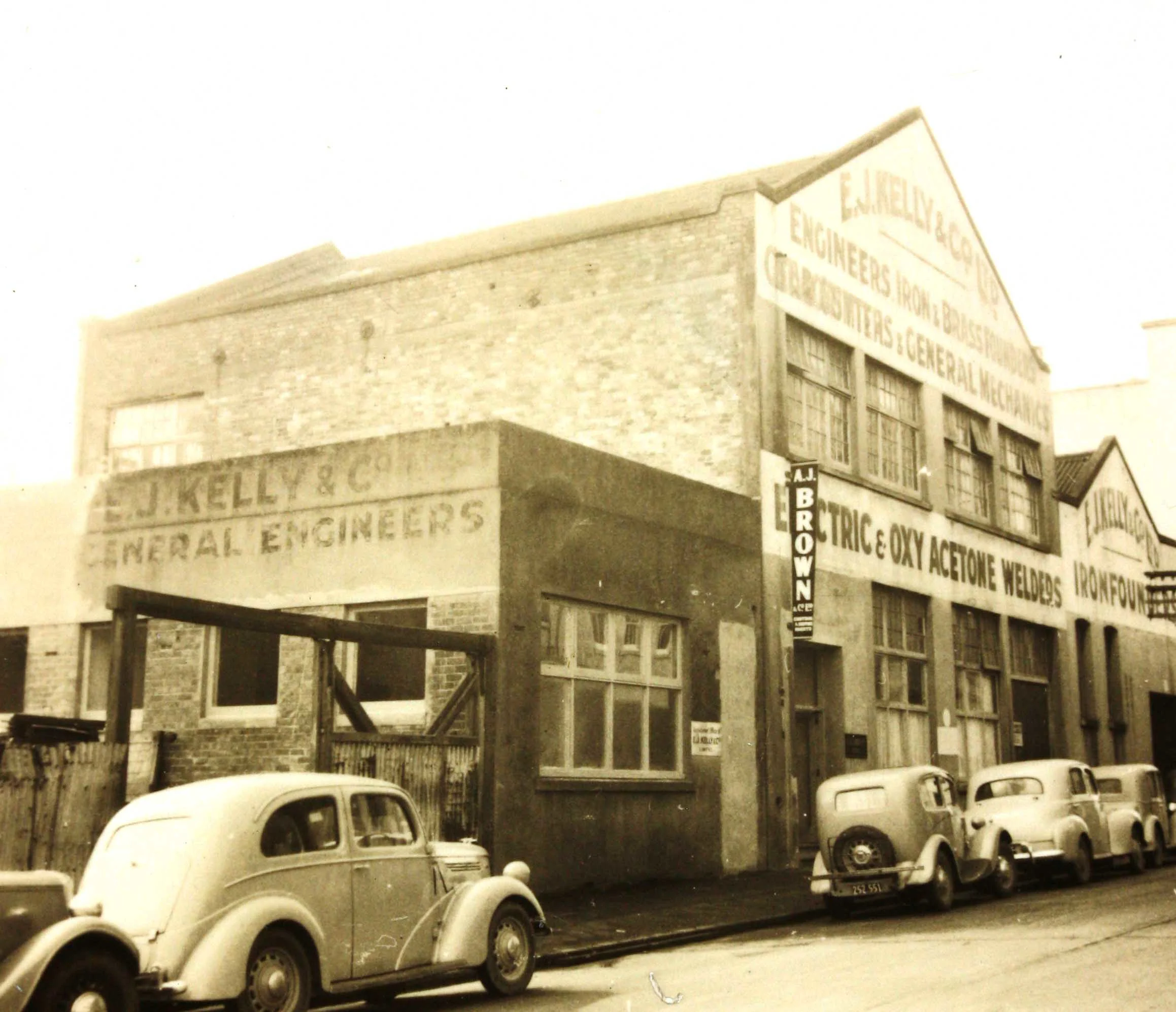 Sepia photo of a factory from the street