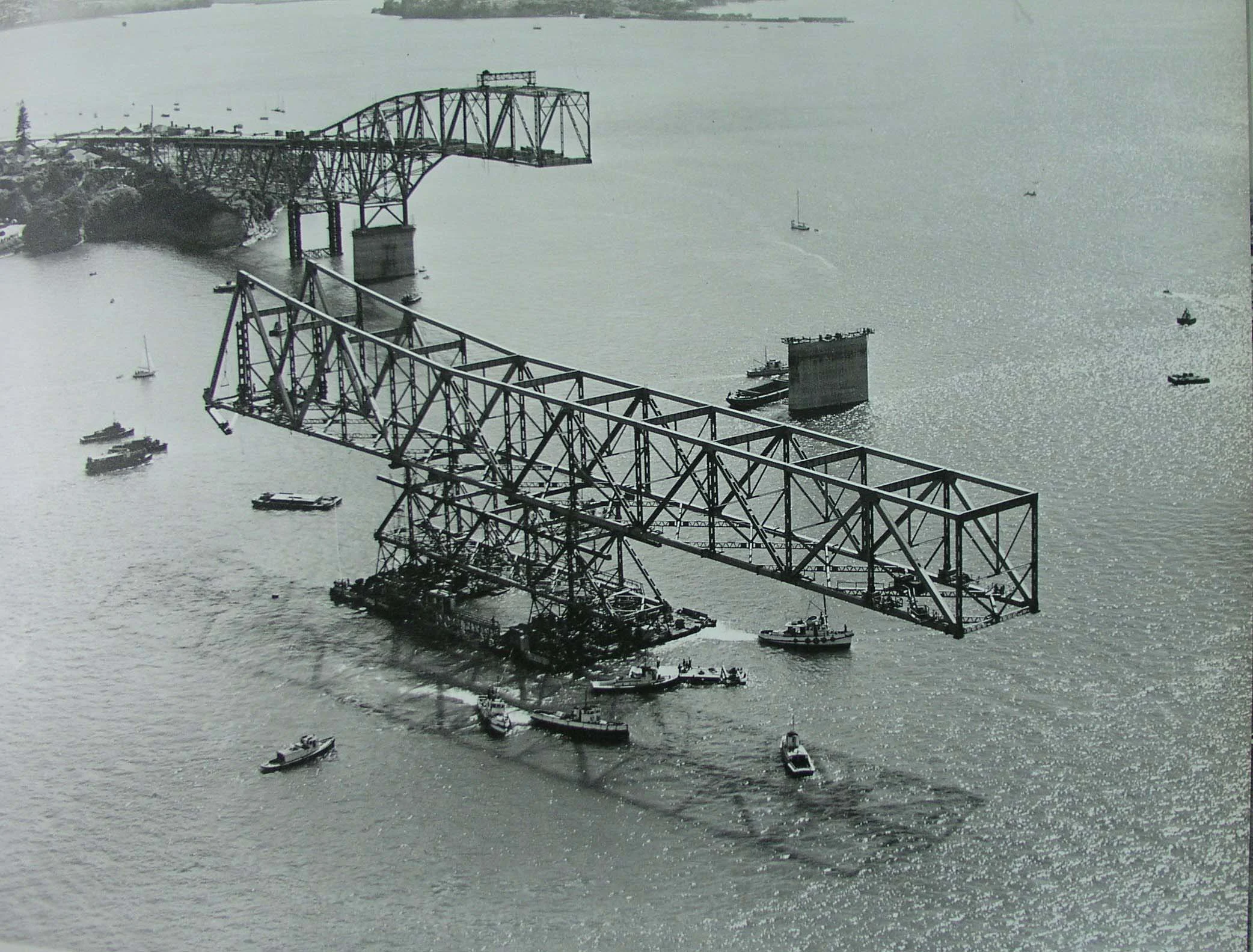 Aerial photo showing construction of Auckland Harbour Bridge on 29 November 1958