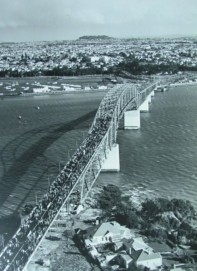 A large number of people crossing the completed Auckland Harbour Bridge