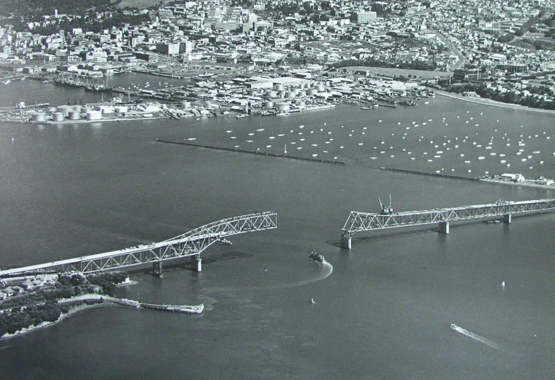 Aerial photo showing the construction of Auckland Harbour Bridge on 16 January 1959