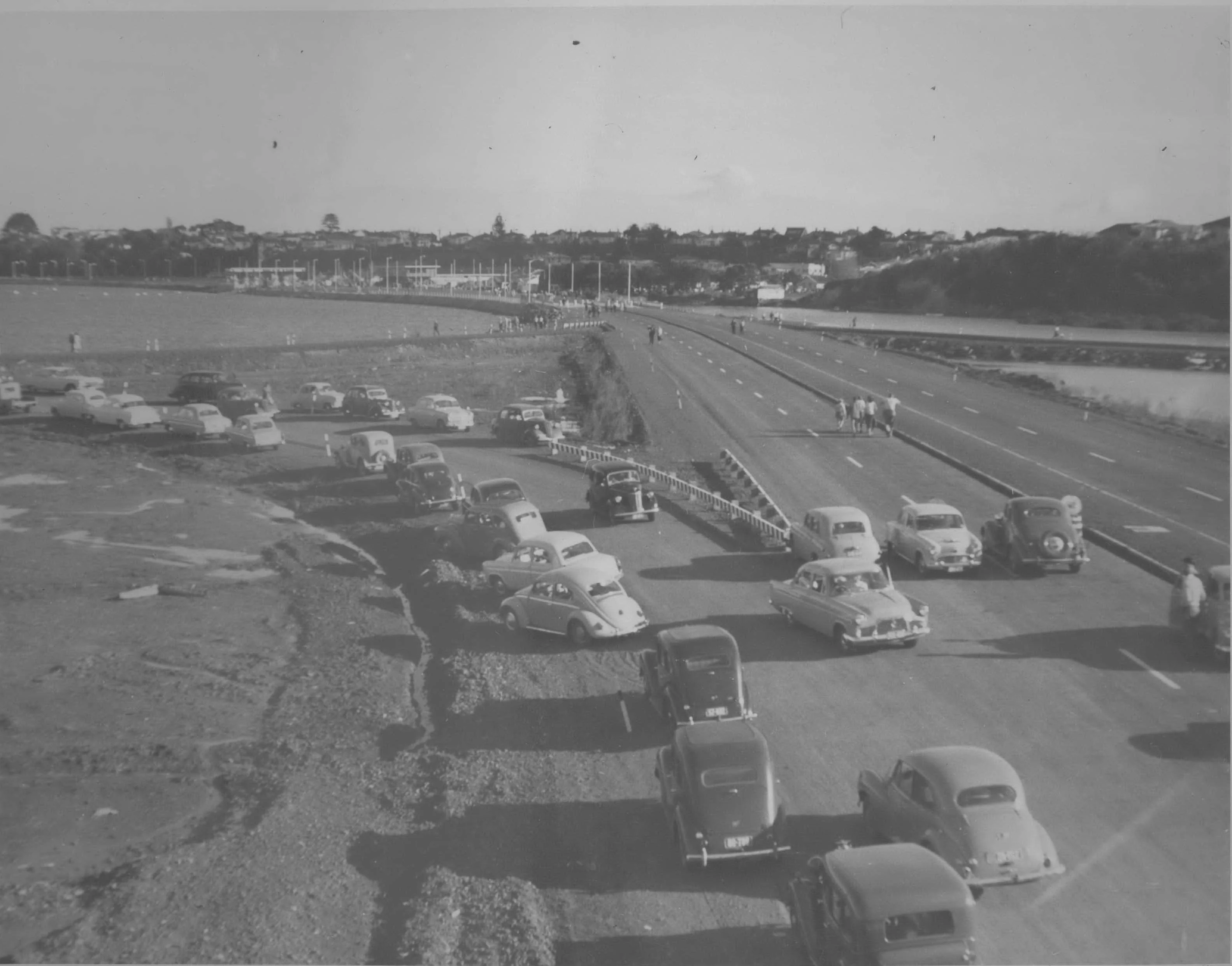 Cars on the road approaching Auckland Harbour Bridge.