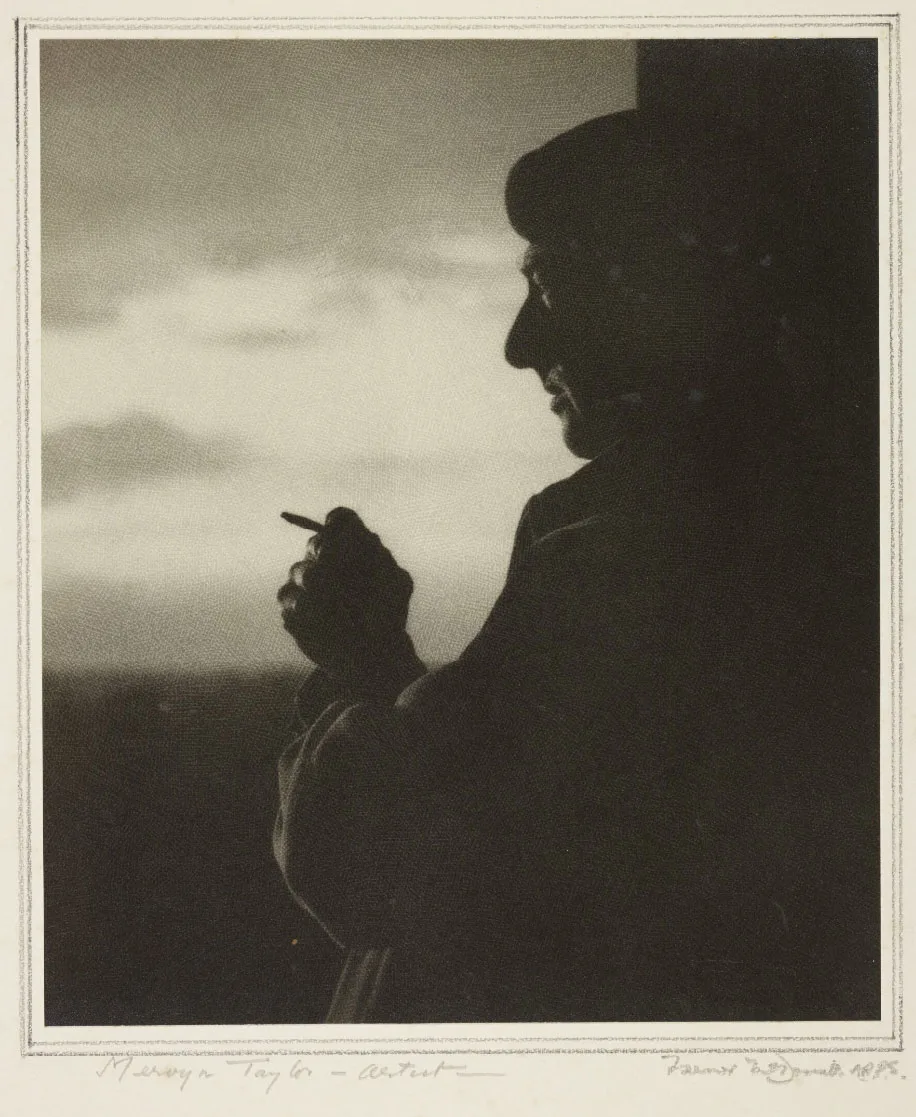 Silhouette of a man standing with a cigarette in his right hand