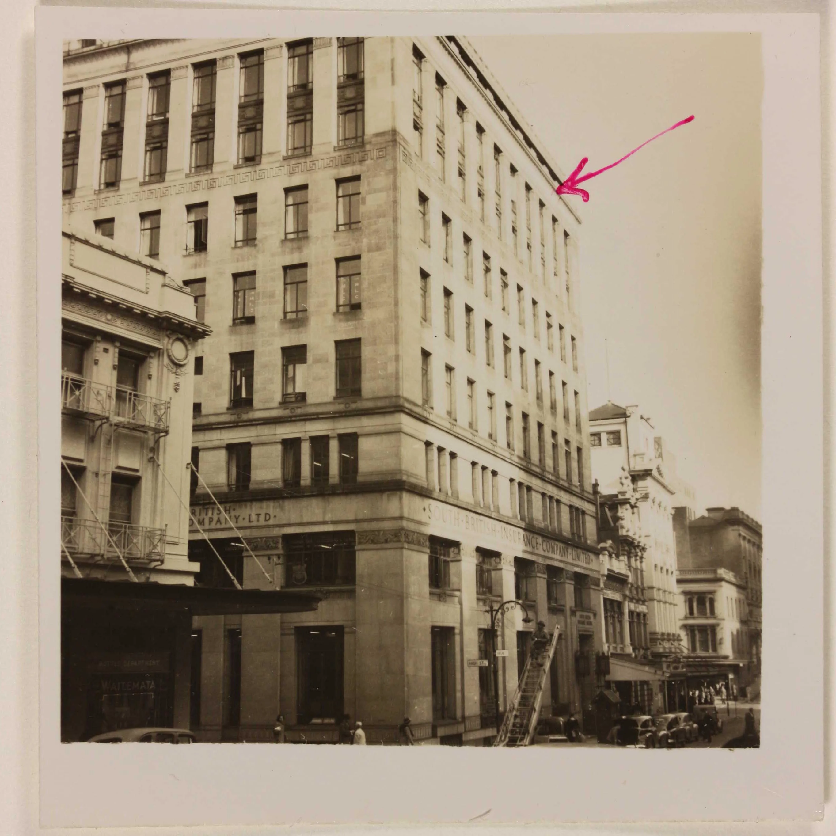 A sepia photo showing the corner of the South British Insurance Company building