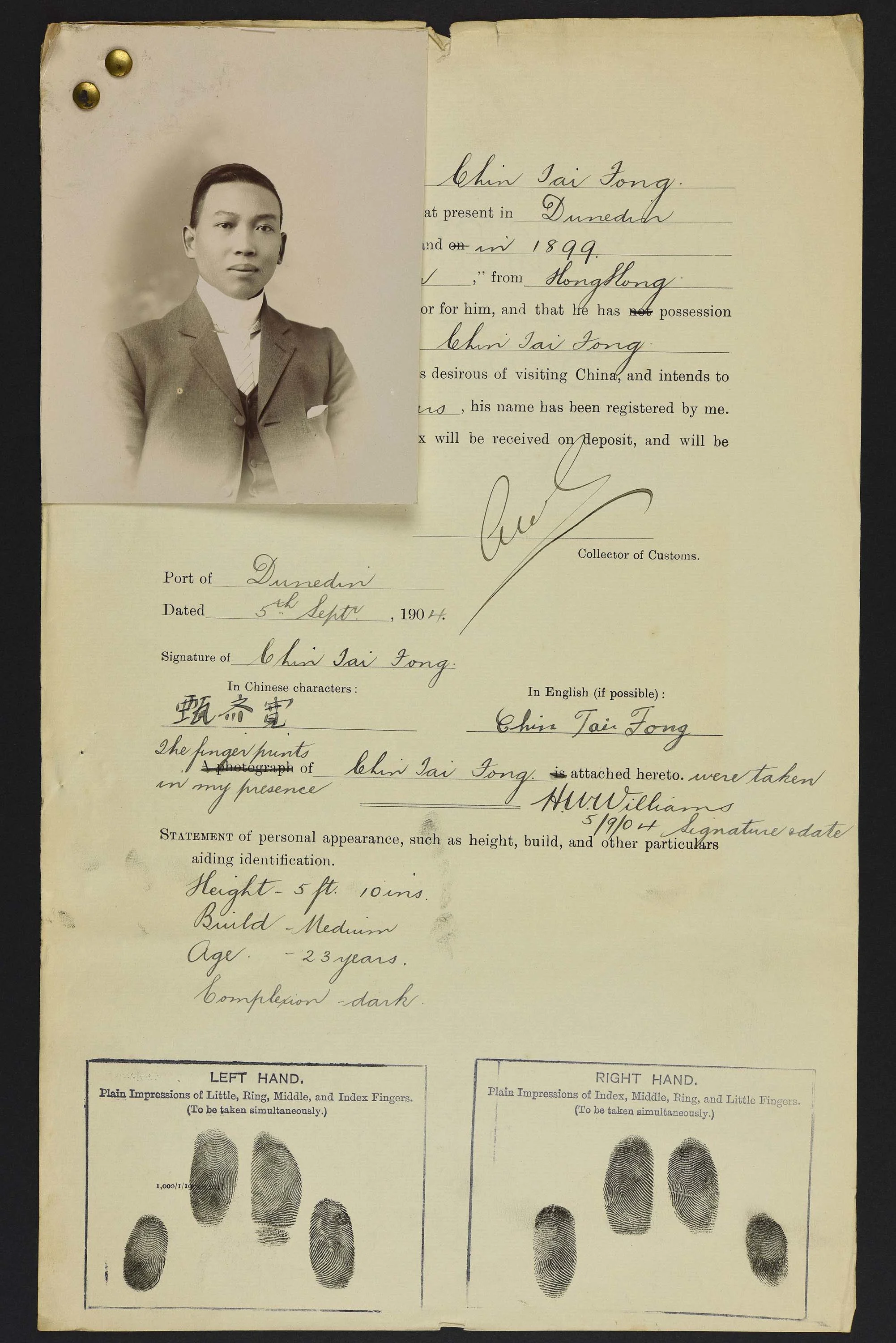 Sepia photo portrait of a Chinese man pinned to his immigration papers