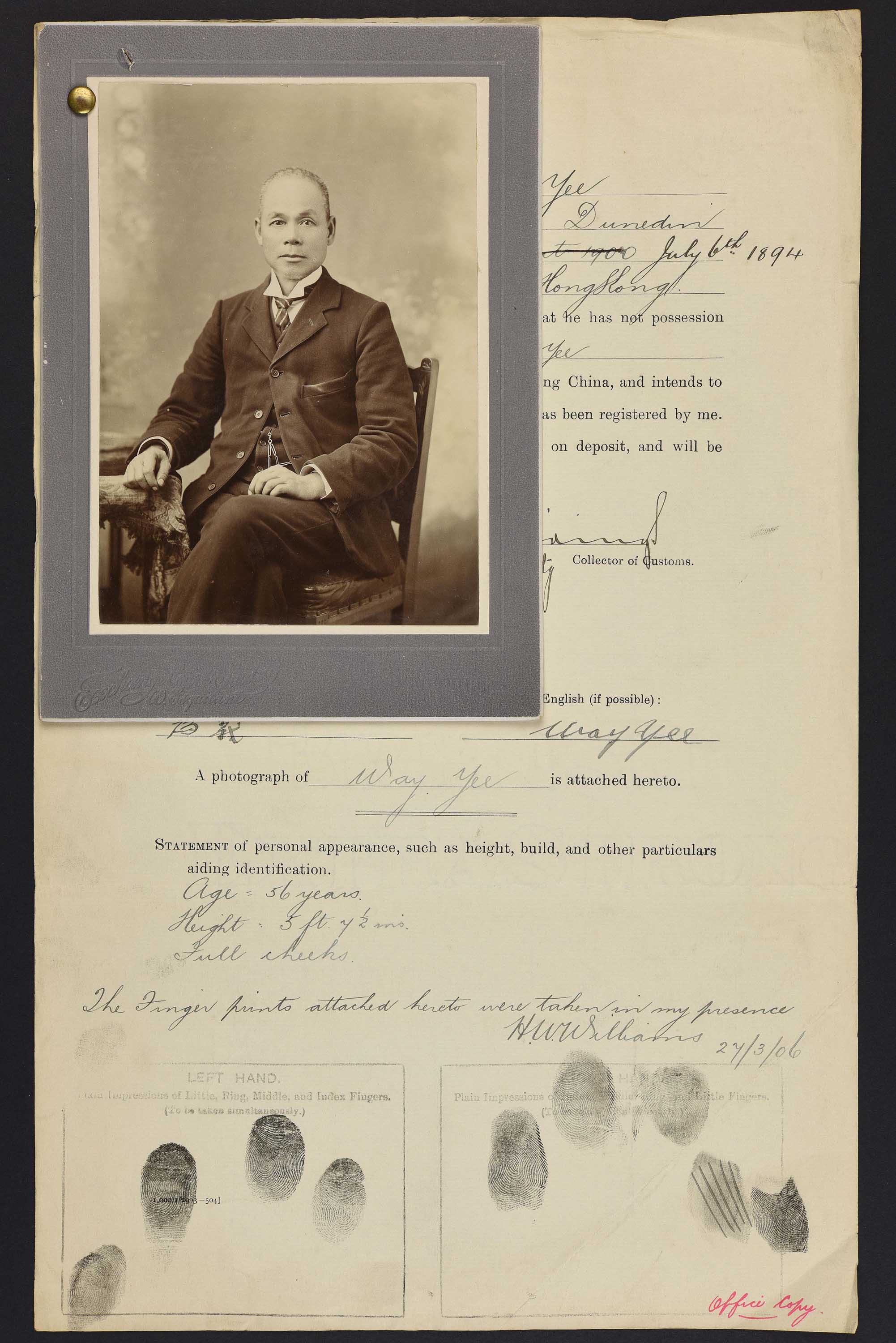 Sepia photo of a seated Chinese man attached to his immigration papers.