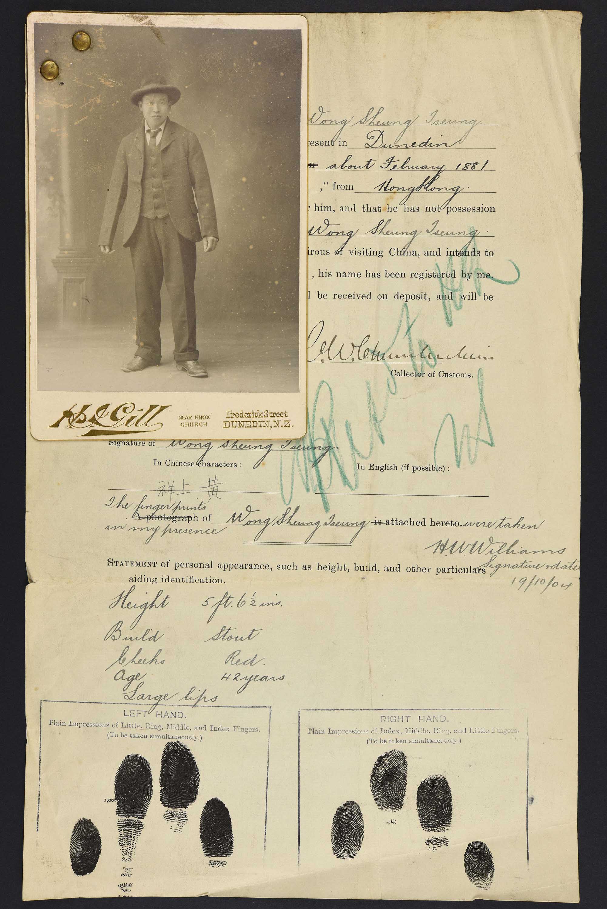 Sepia photo portrait of a standing Chinese man pinned to his immigration papers