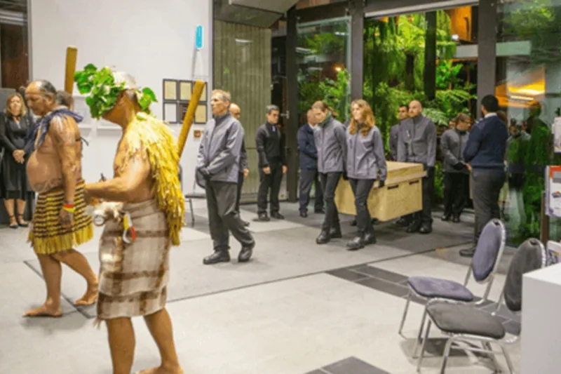 Archives NZ staff led by Ngā Toa/Valiant warriors bringing the documents into their new home