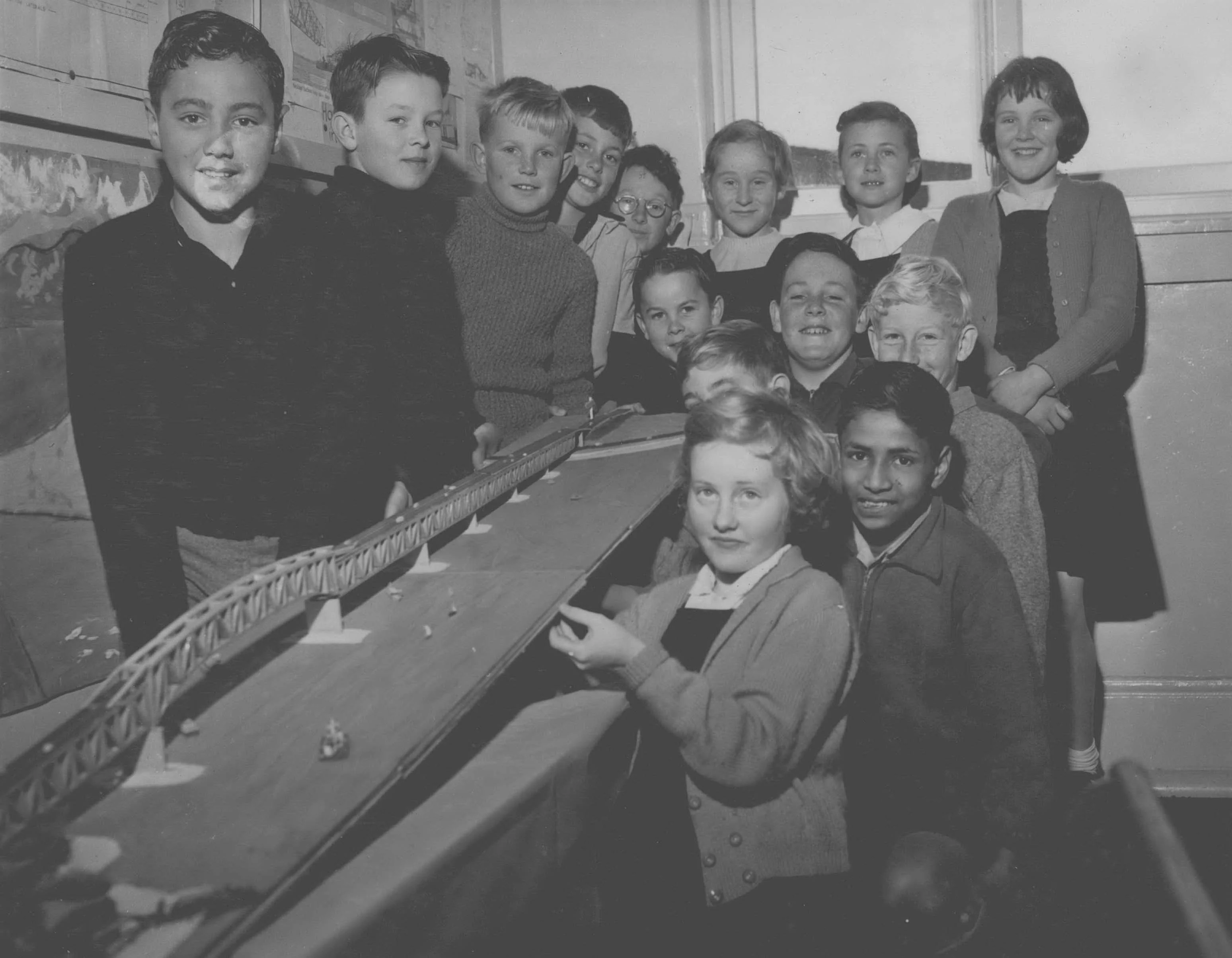 Pupils of the school pose with model of the bridge