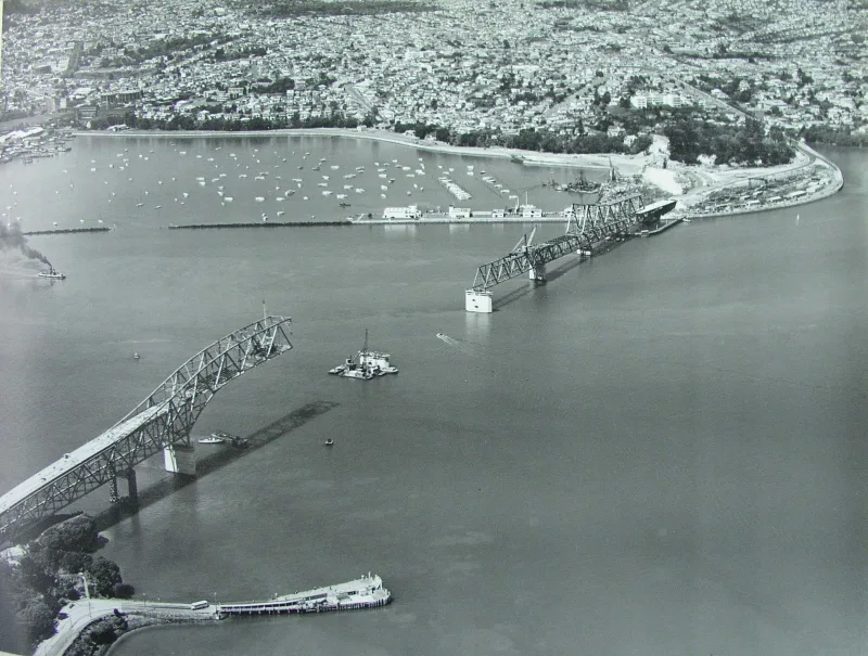 Aerial photo showing construction of Auckland Harbour Bridge on 29 October 1958