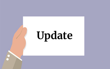 Illustration of a hand holding a white card with words 'Update written' on it, on a purple background