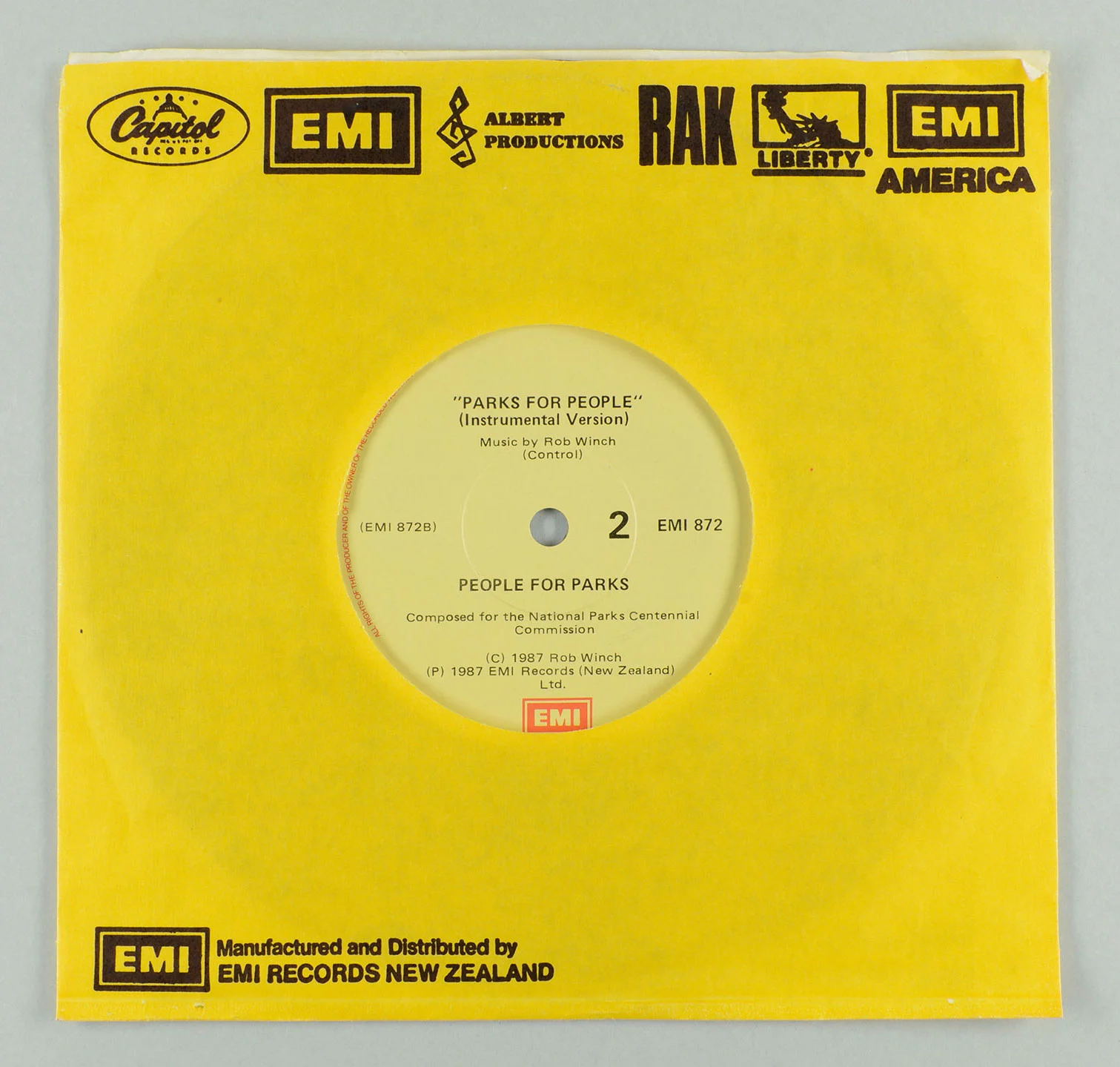 A bright yellow vinyl cover with black logos on the top and bottom 