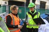 Waste management experts on a building site.