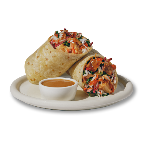 KBBQ Chicken Wrap on a plate with side of dressing