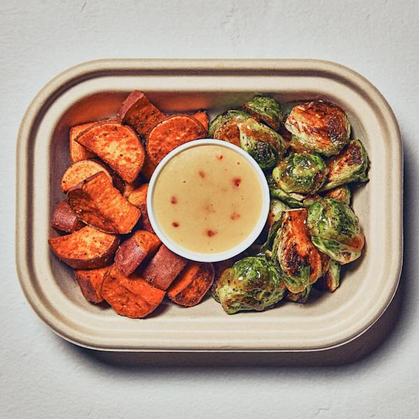 Seasonal side featuring maple glazed brussels sprouts and roasted sweet potatoes