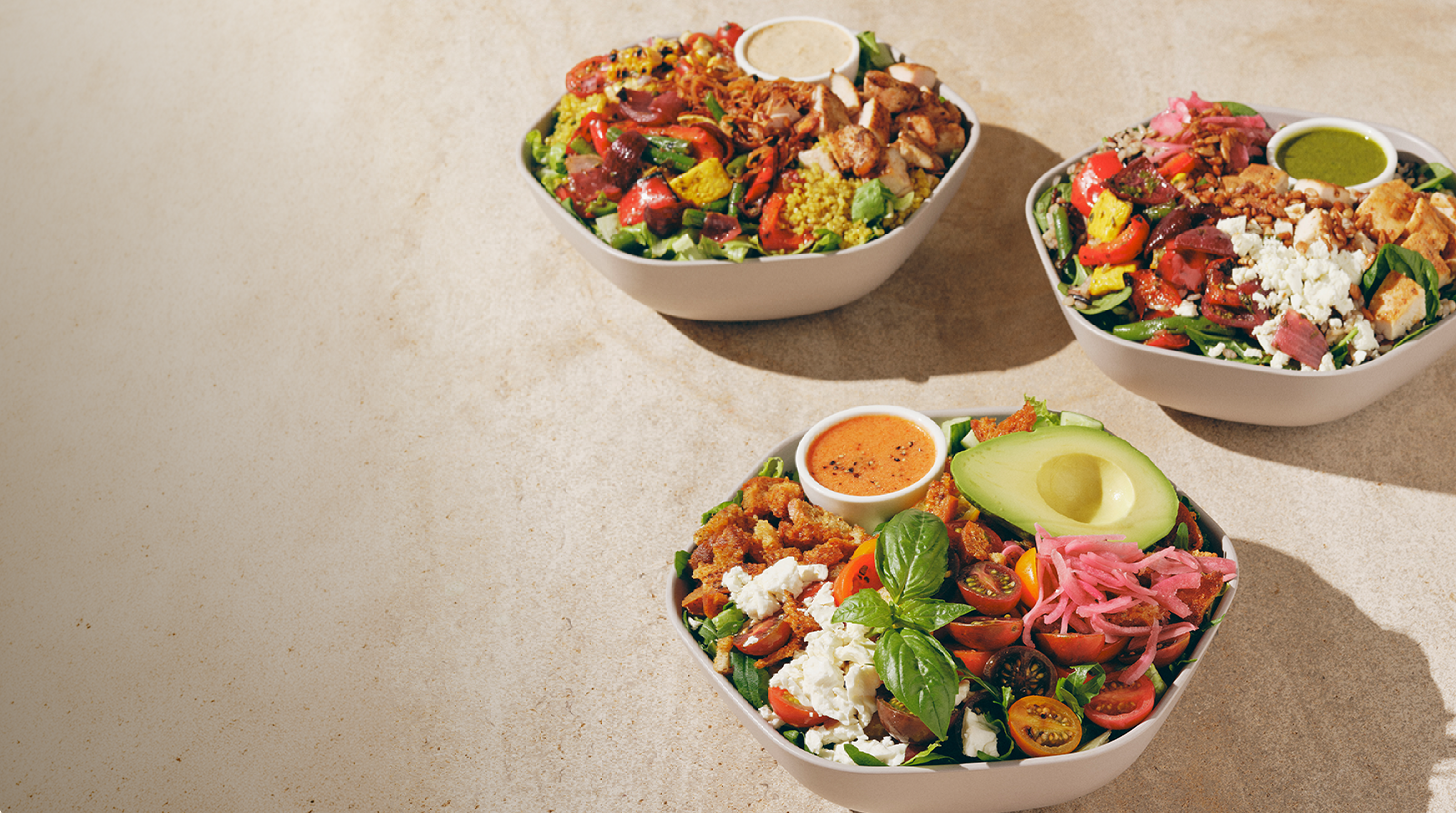 Three summer menu bowls: summer market bowl, tomato panzanella, and picnic bowl