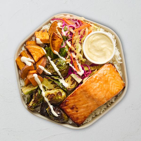 Sweetgreen Maple-Glazed Salmon Bowl over rice with sweet potato, Brussels sprouts, and slaw.